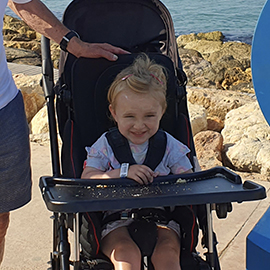 Abi-Rose in her pushchair