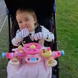 Abi-Rose in her Snappi pushchair