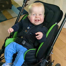 Alec in his Snappi pushchair