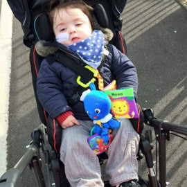 Alfie in his special needs Snappi pushchair