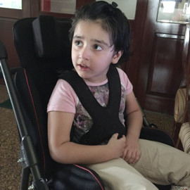 Ameera in her special needs Snappi Buggy