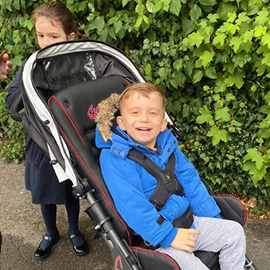 Charlie in his Swifty pushchair