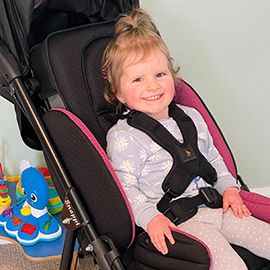 Elodie in her snappi buggy