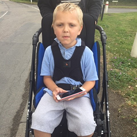 Jenson in his Snappi pushchair