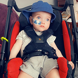 kayson in his pushchair