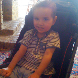 Mac in his Snappi Pushchair