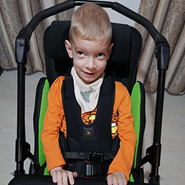 Mark in his Snappi pushchair
