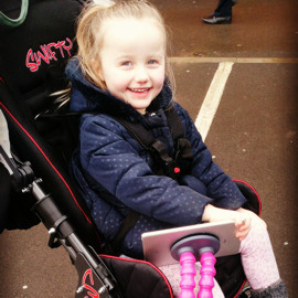 Millie in her Swifty buggy