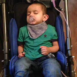 Mohammed in his Snappi Pushchair