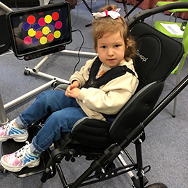 Phoebe in her Snappi pushchair