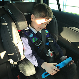 Thomas in his car seat