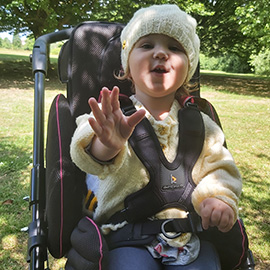Willow in her Snappi pushchair