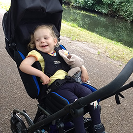 Zoe in her Swirl pushchair